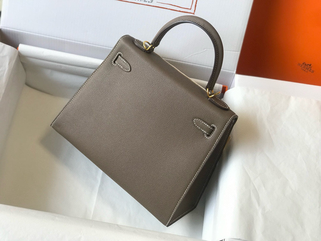HM KELLY 25 ÉTOUPÉ CUIR EPSOM FERMOIR DORÉ